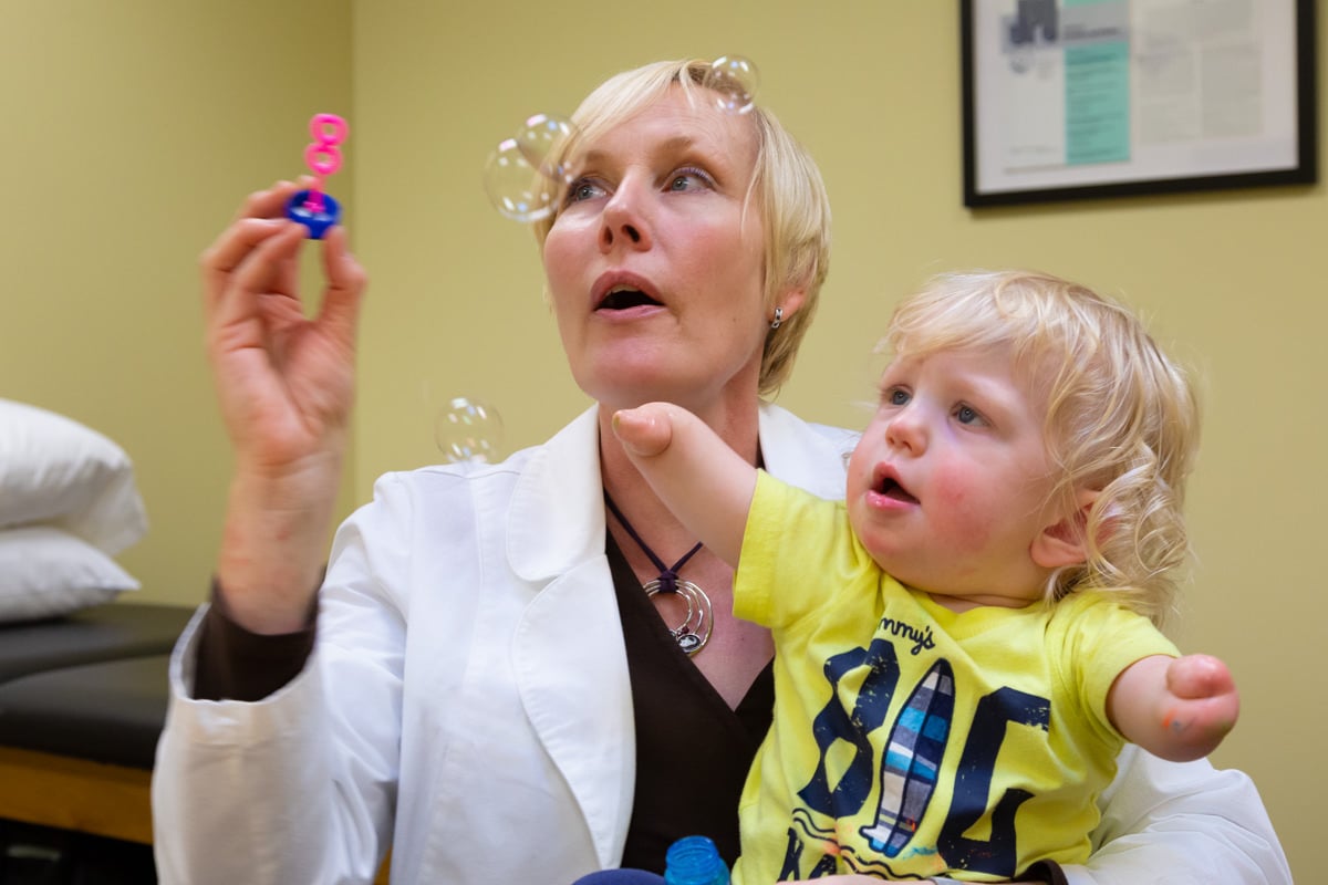 Clinical Therapy Specialist works with pediatric congenital bilateral patient Jameson Davis in our Portland Center