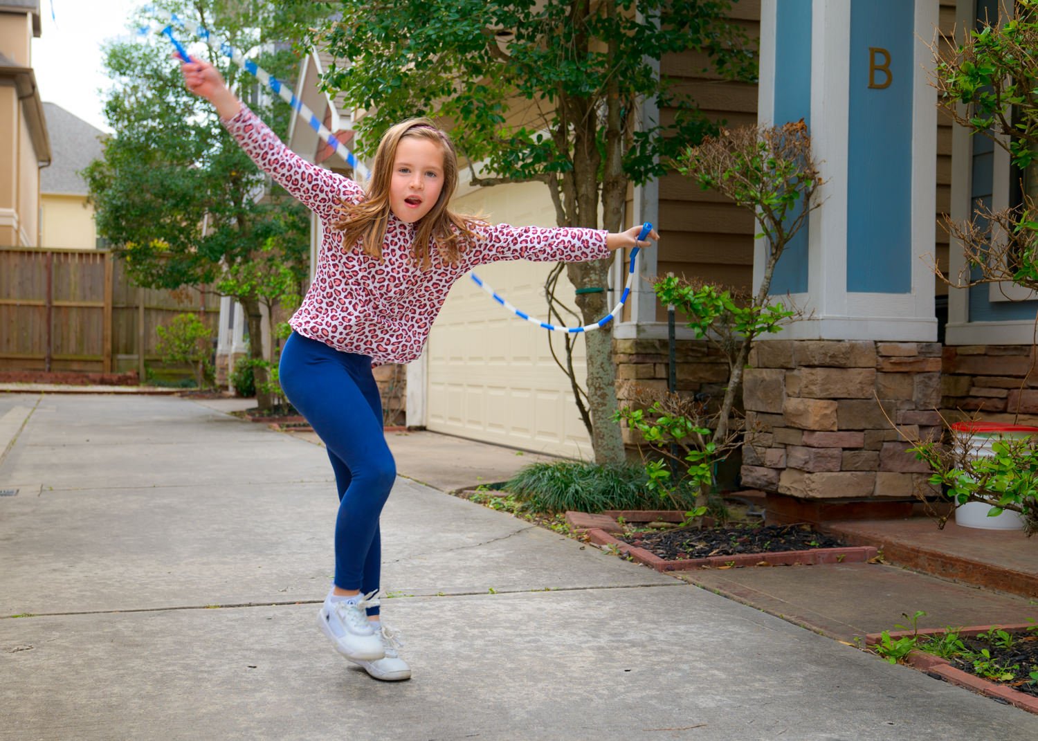 Autumn jump roping with her myoelectric hand