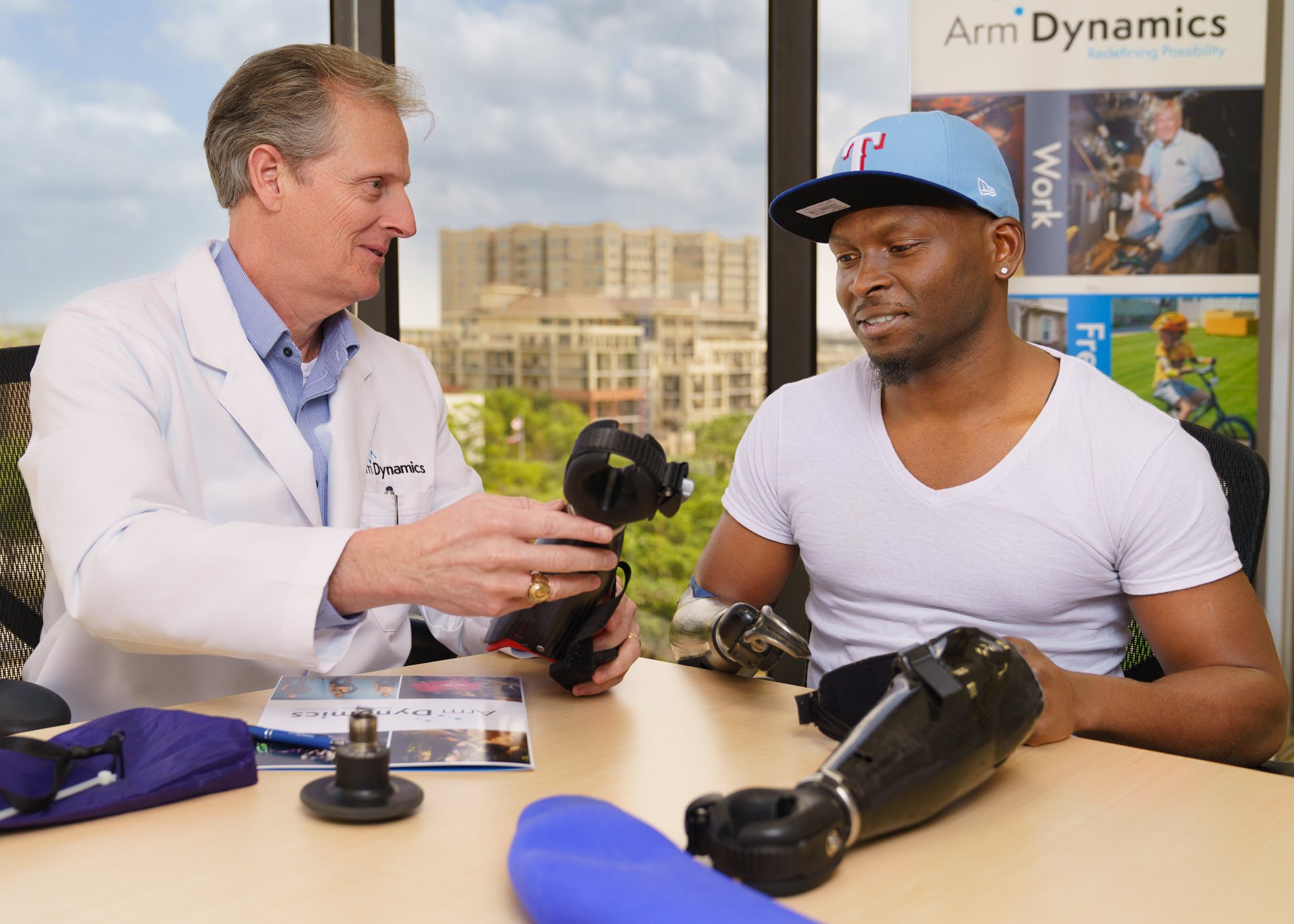 Scott Spring, CPL discusses several prosthetic options to help Houston patient Xavier Collier achieve his goals